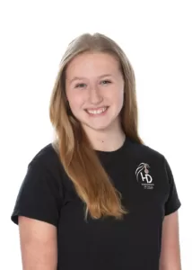 A young girl in a black t-shirt smiling at a wedding in Gettysburg, Pennsylvania.