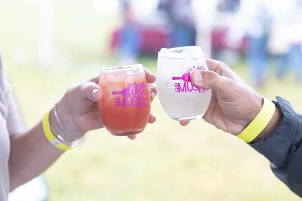 two wine glasses being held at the Gettysburg wine and music festival 